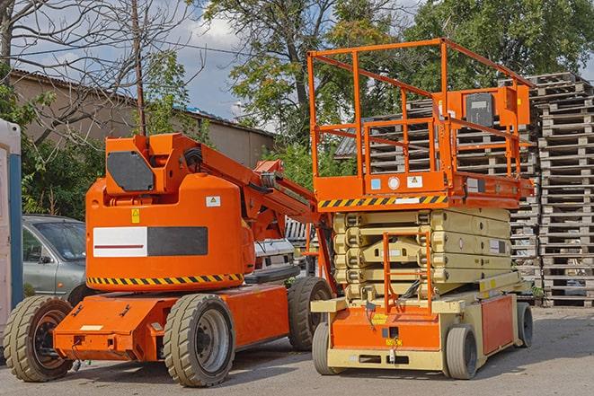 forklift transporting goods in a busy warehouse setting in Batavia